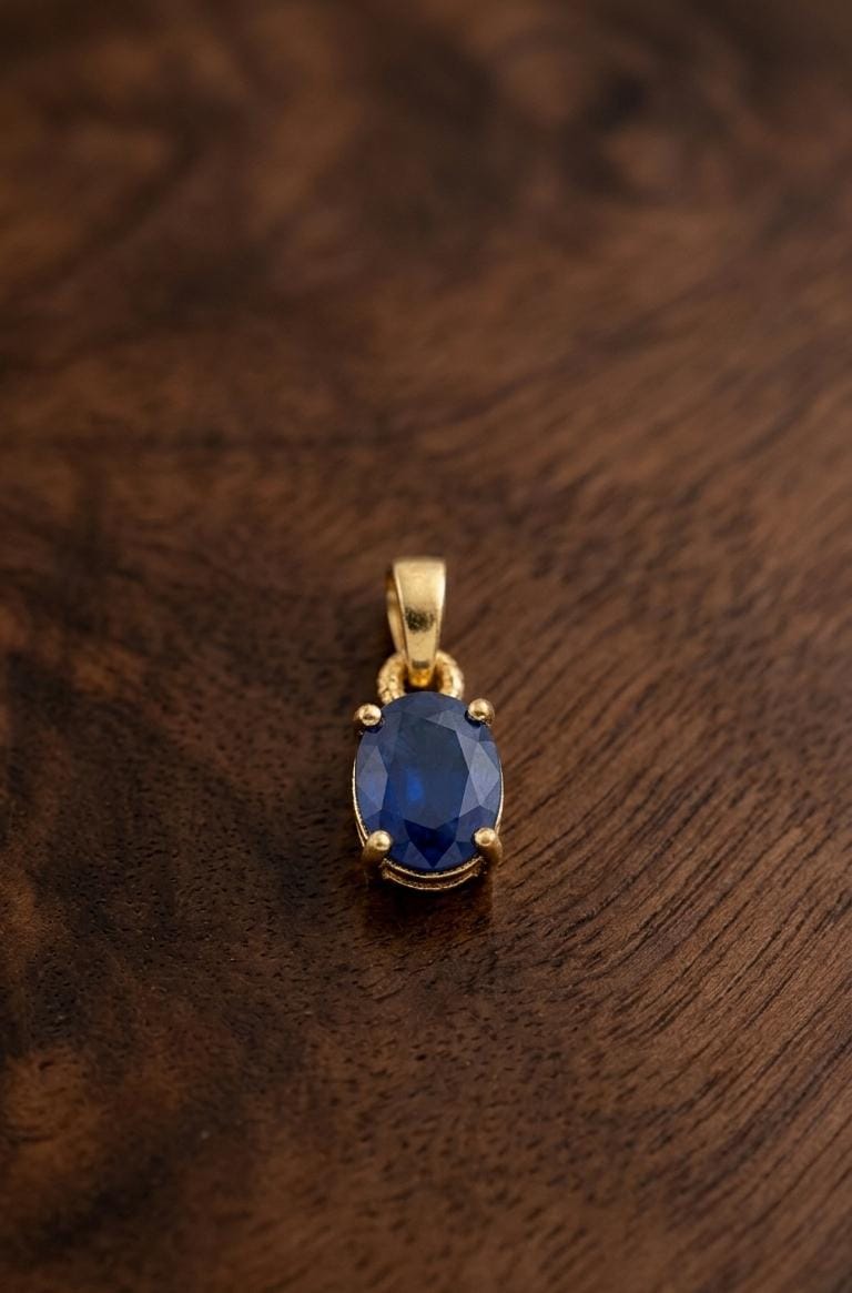 Oval cut deep blue sapphire pendant 